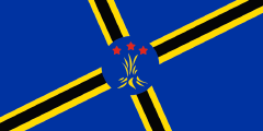 2019 Martinique flag proposal: blue with a skewed black cross outlined in yellow with a fire emblem